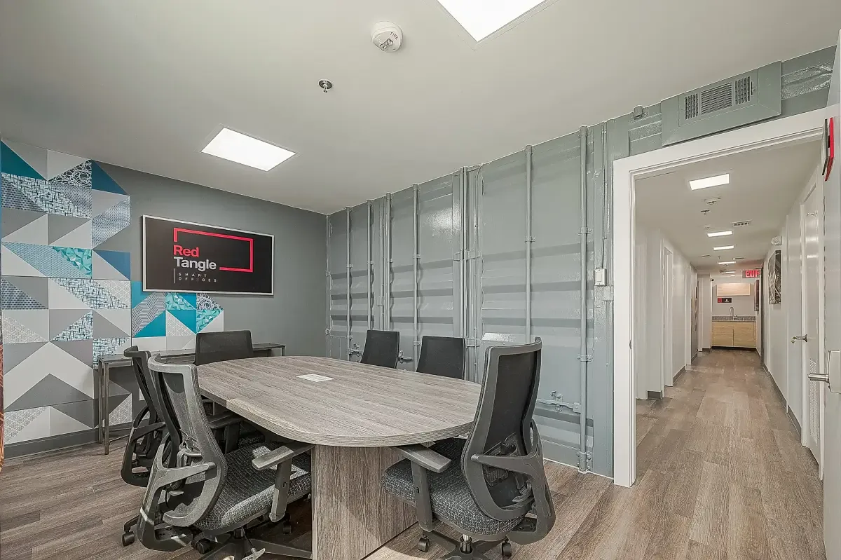 Boardroom with conference table and executive seating at Red Tangle Workspaces in Magnolia, TX