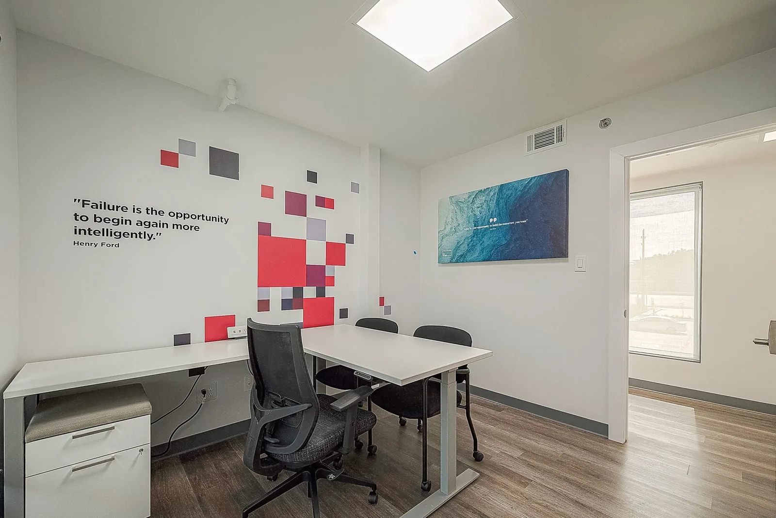 Furnished private office suite with ergonomic desk seating at Red Tangle Smart Offices, Magnolia, Texas
